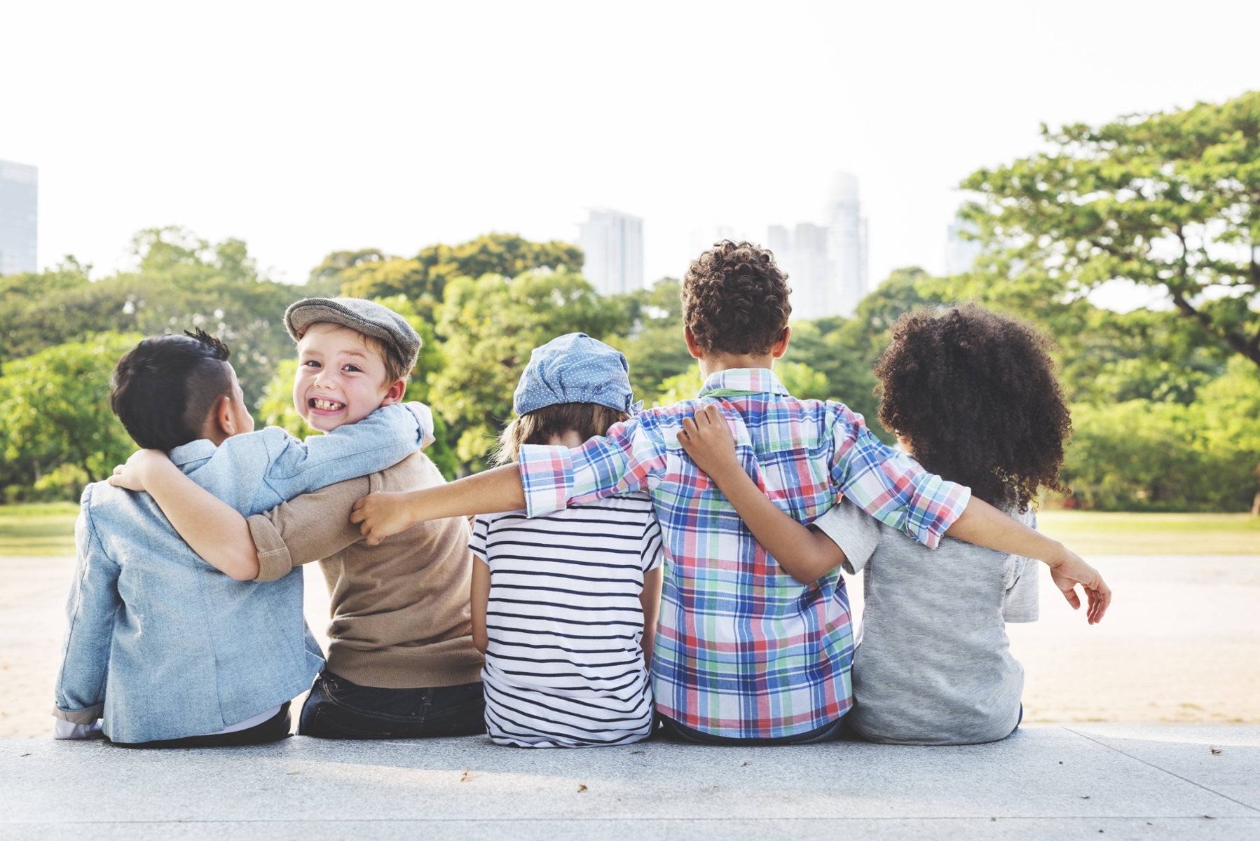group of children linking arms outside at radiance dentistry