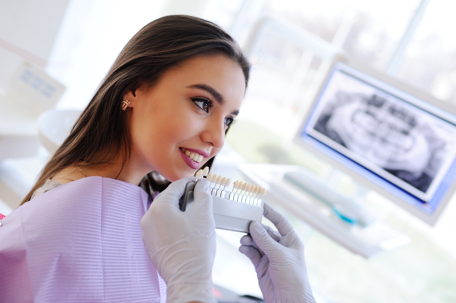 dental patient picking tooth whitening shade in leichhardt